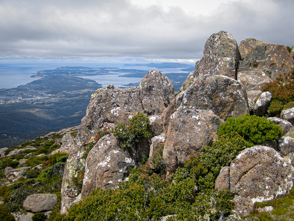rock formation on the kunanyio/Mt Wellington summit with Hobart city in the background