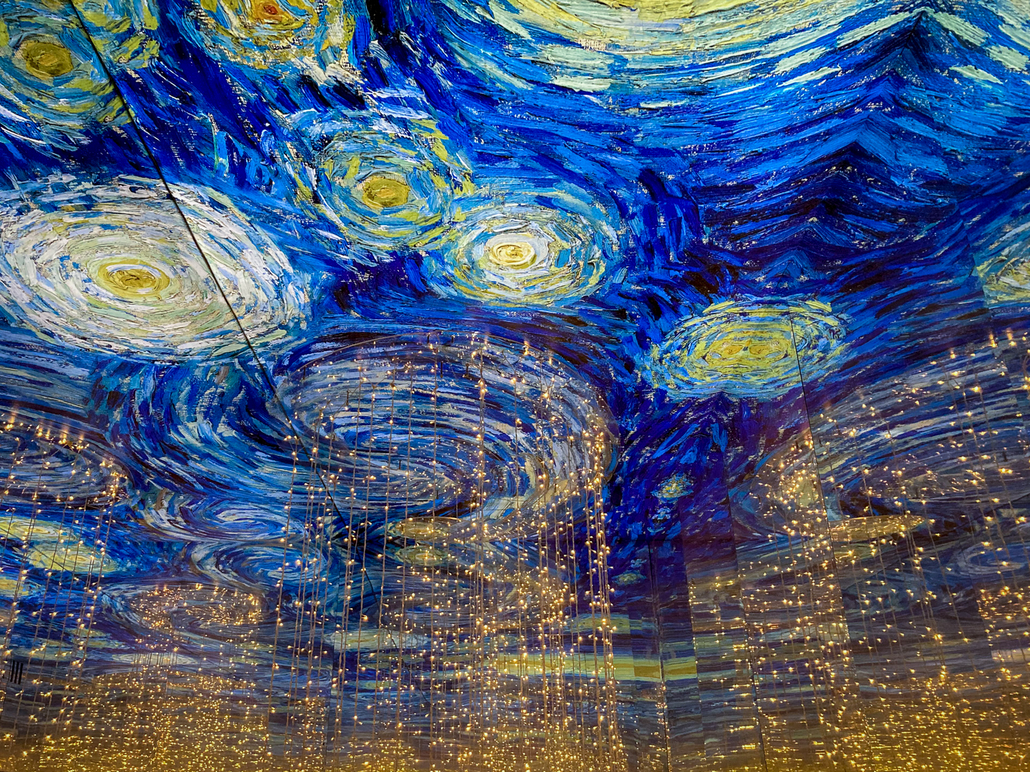 A kaleidoscope room of Van Gogh's Starry Night 