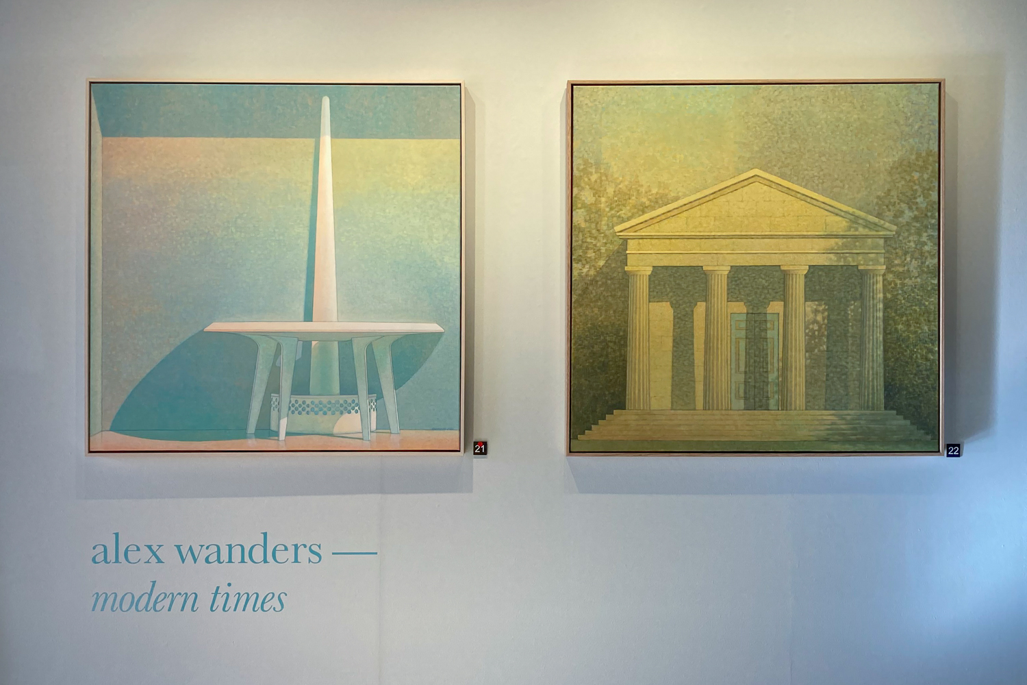 Paintings of a fountain and a hall with columns out front with the text "Alex Wanders—Modern times" beneath
