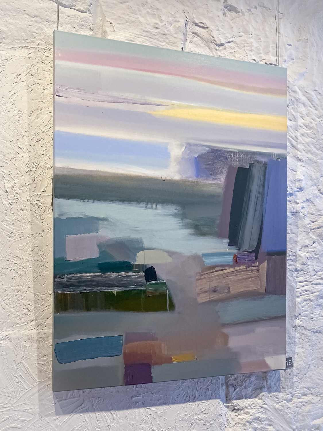 An abstract landscape painting of a coastline in pastel colours
