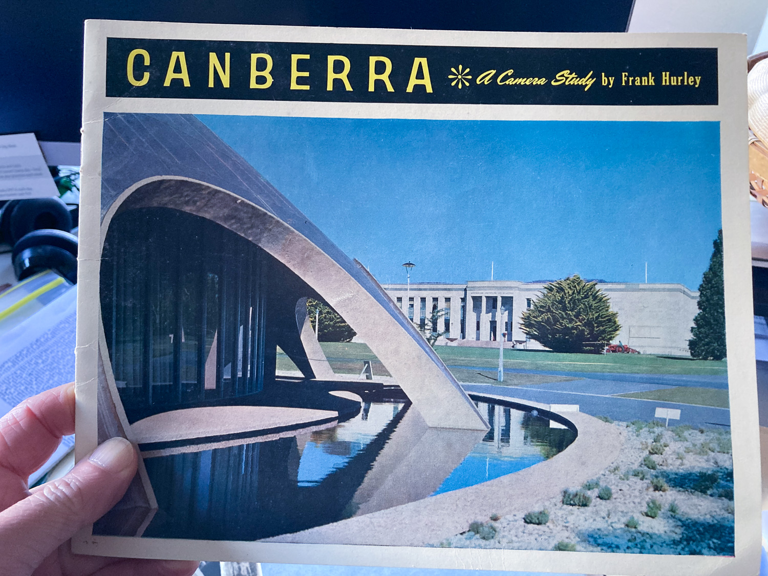 The front cover of a book called Canberra with a photo of a dome-like concrete building