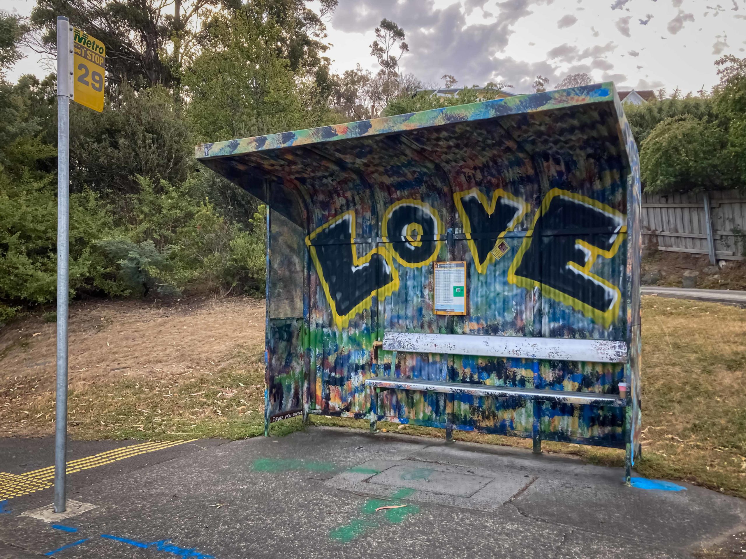 Graffiti of the word LOVE on a bus shelter