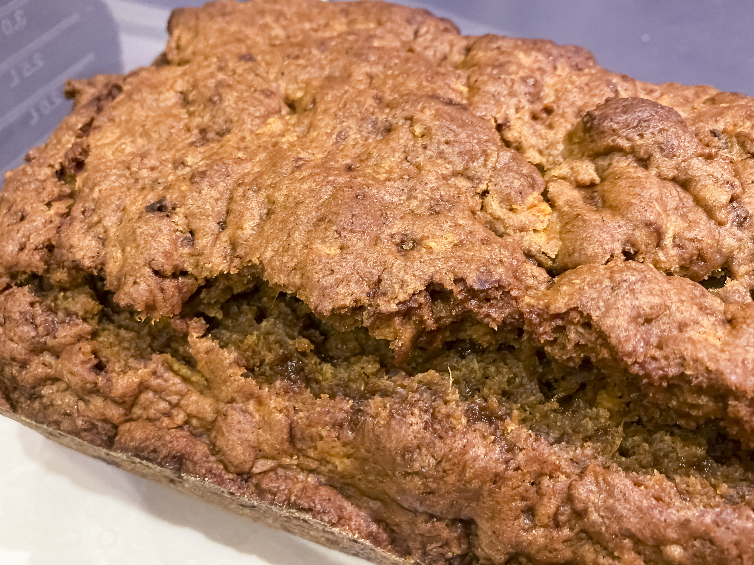 A golden loaf of baked bread made with sweet potatoes. it is textured and looks very tasty