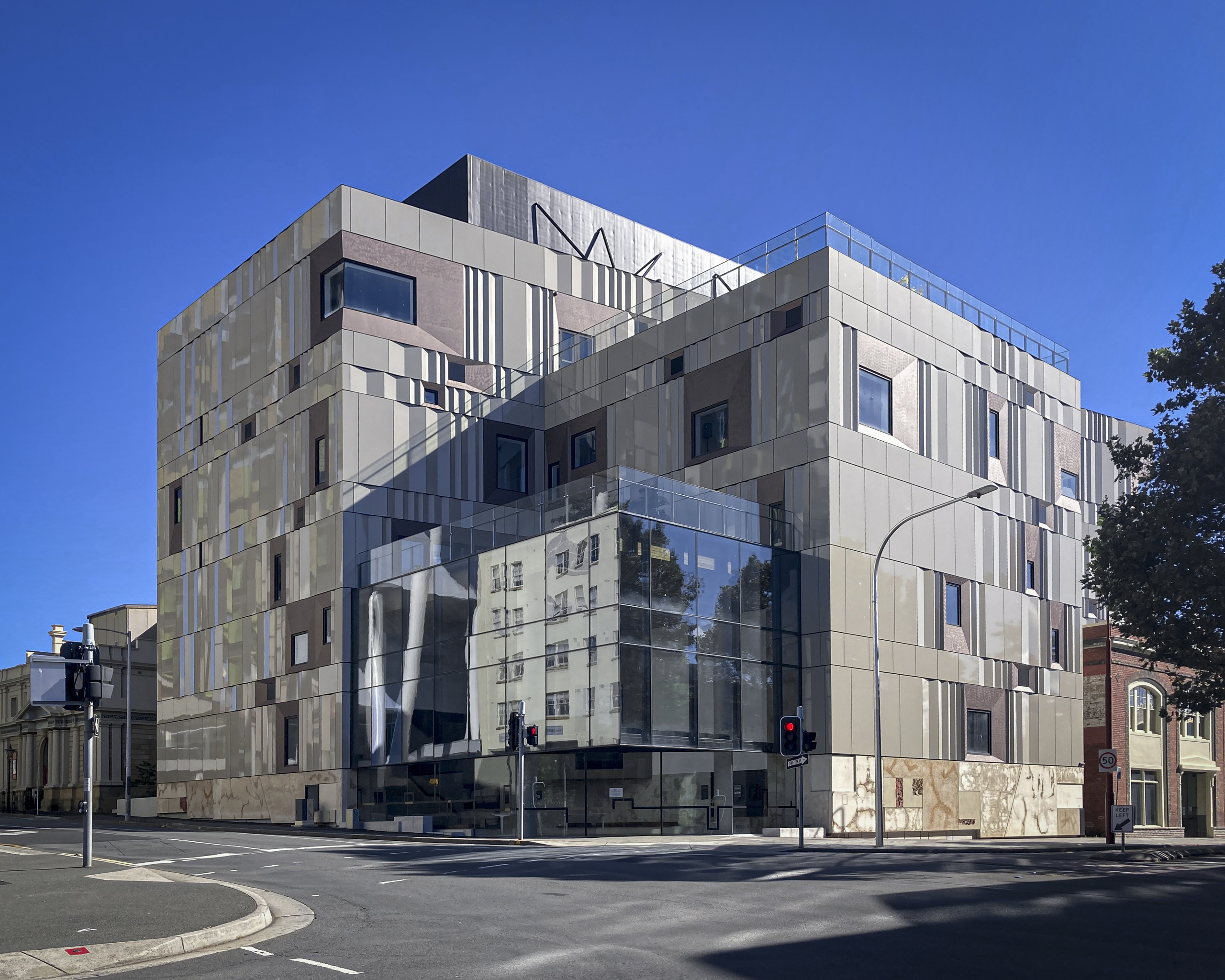 A blocky, modern multi-storey building in shades of beige