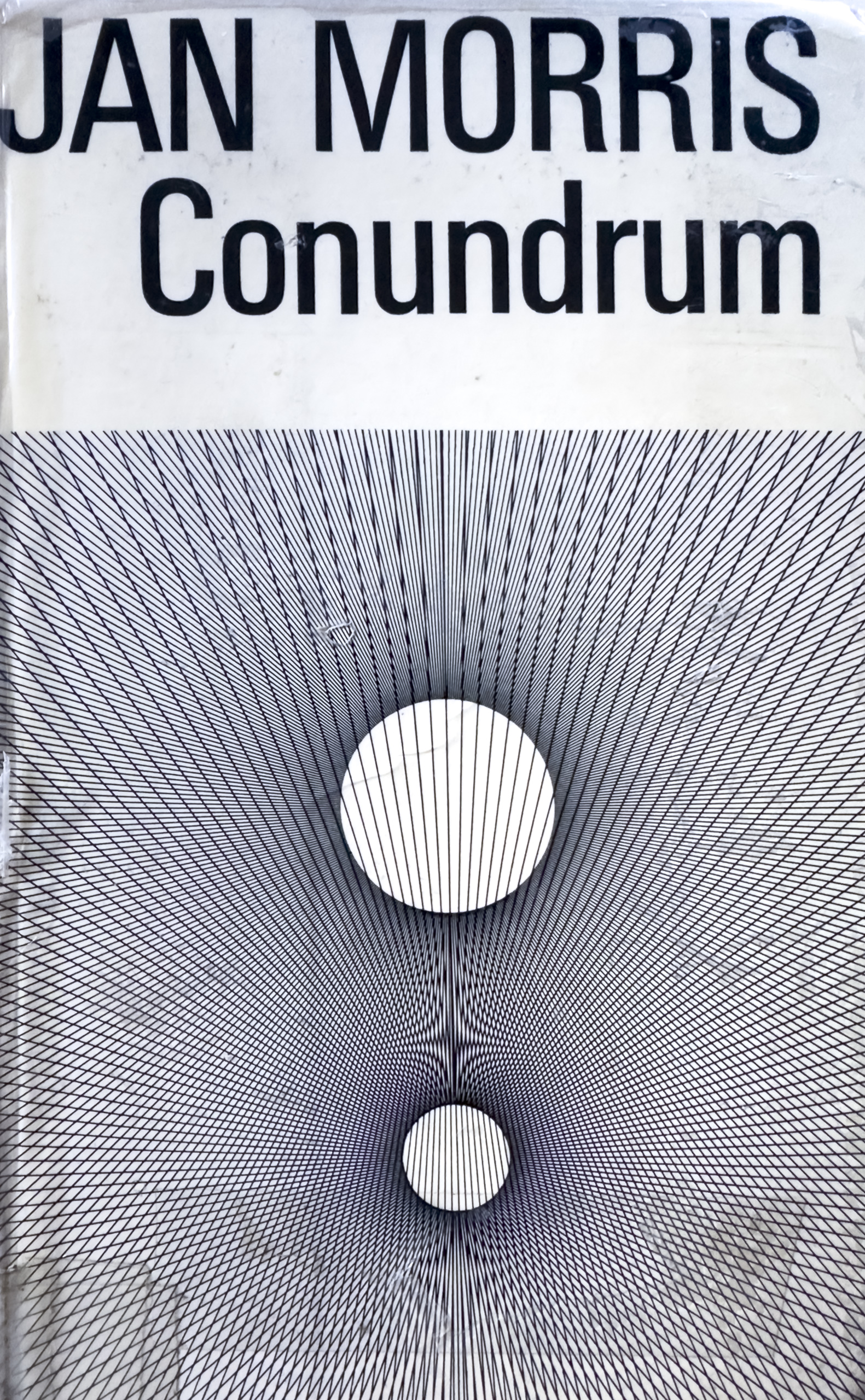 The cover of a book called Conundrum by Jan Morris with a series of lines and circles as the main illustration