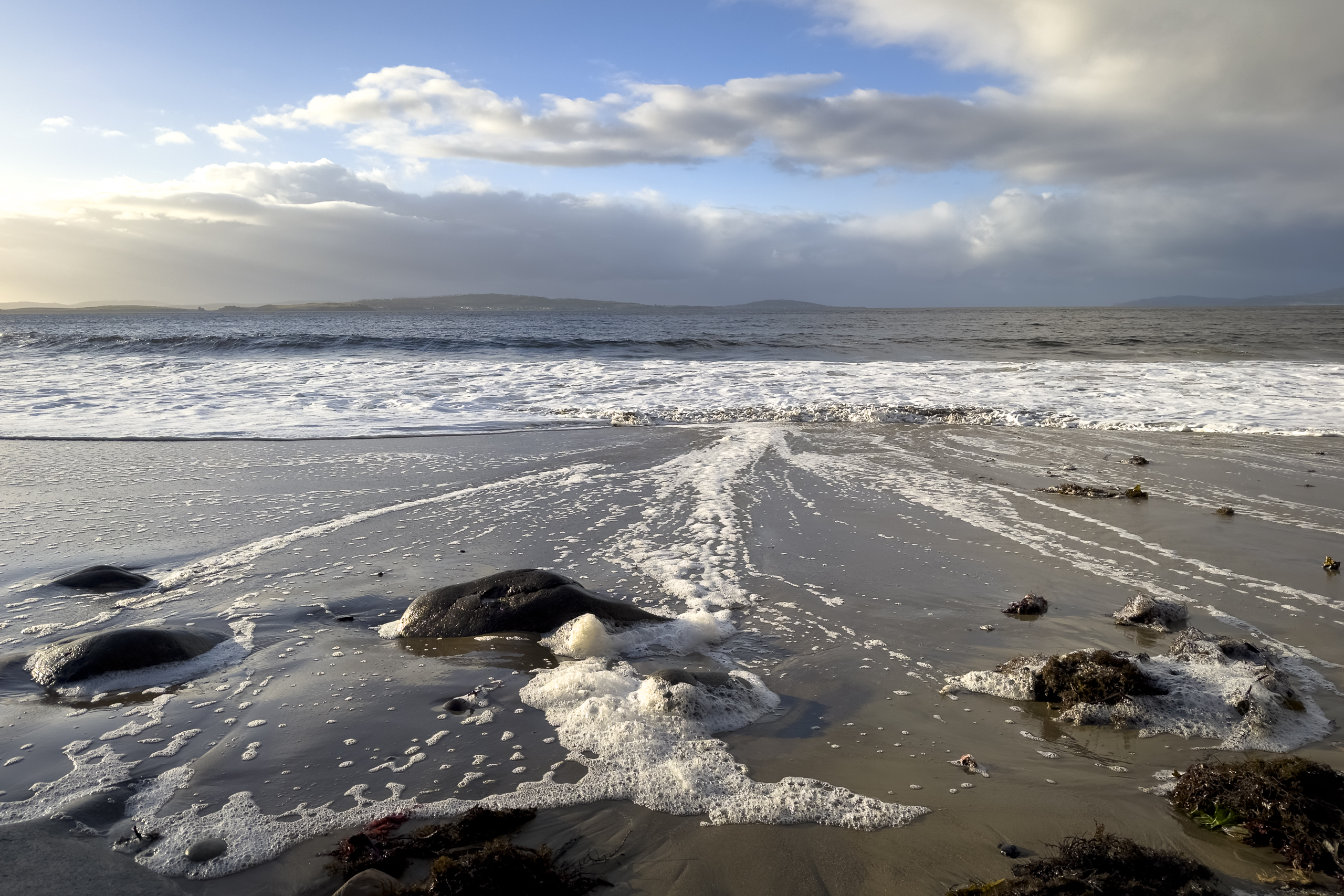 The water going out on the beach