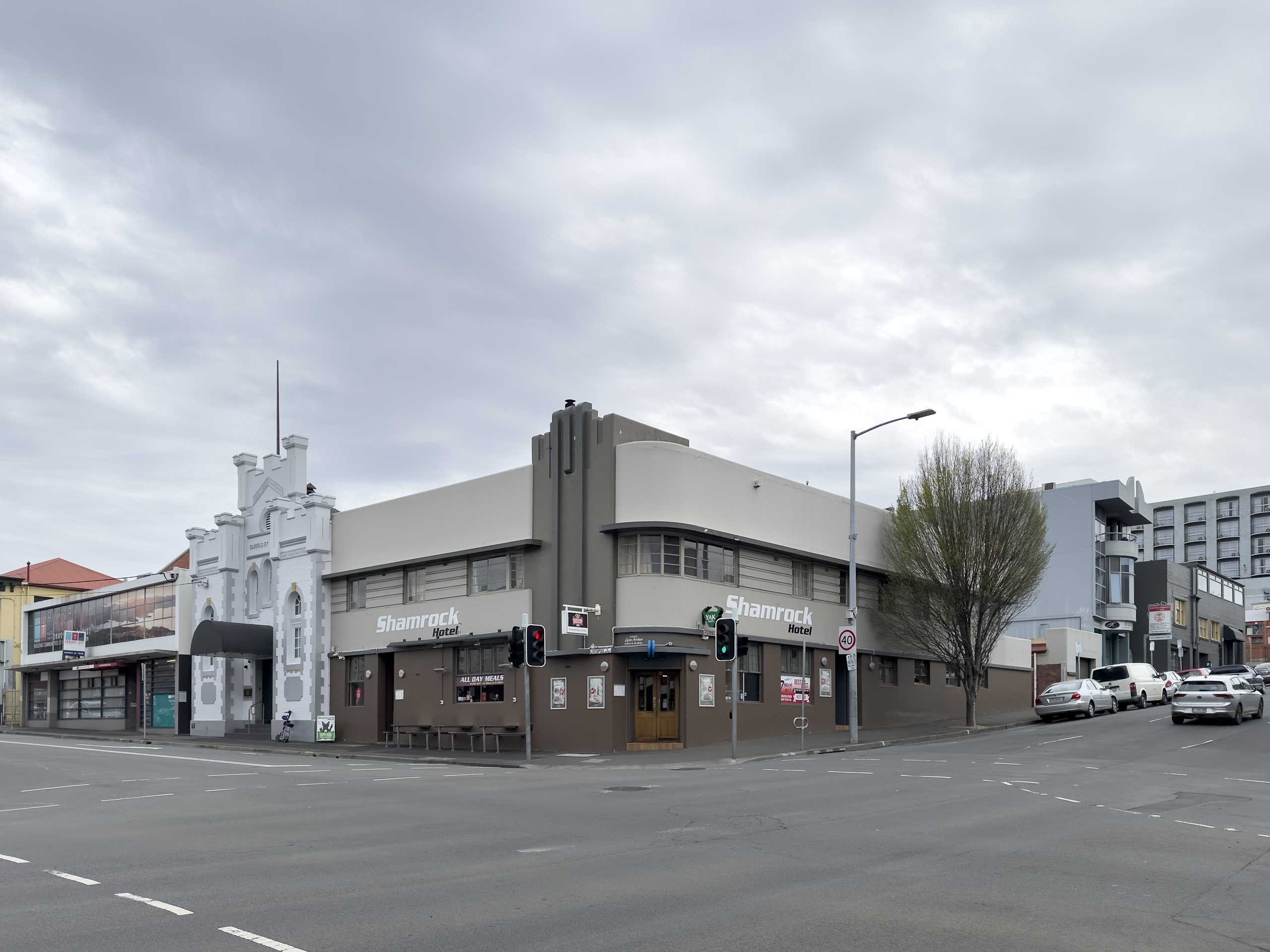 A corner hotel made to look like the art deco style painted in shades of beige and brown