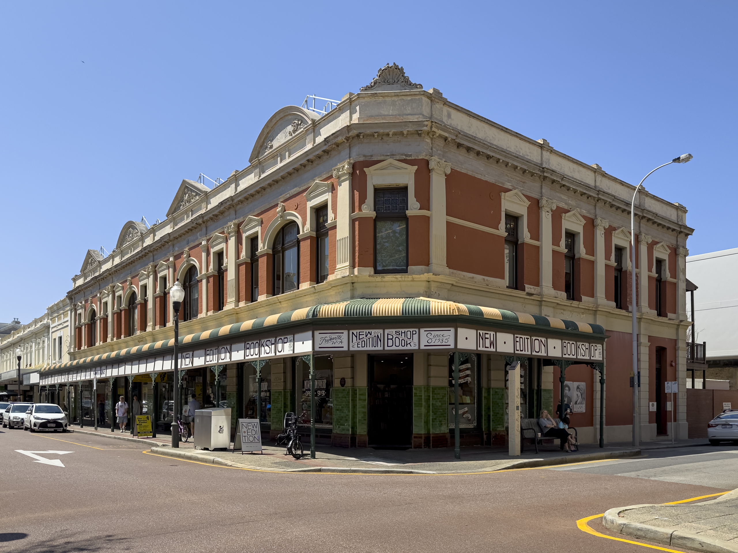 An old building on a street corner called New Edition Bookshop