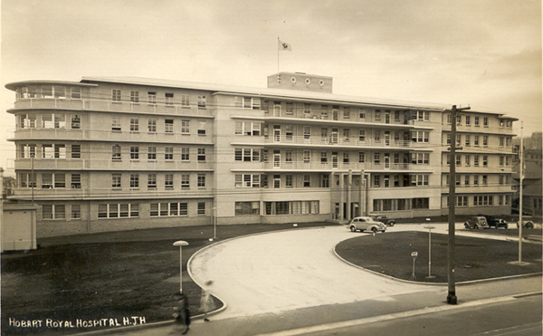 An old black & white photo of a 5-storey art deco/modernist hospital building