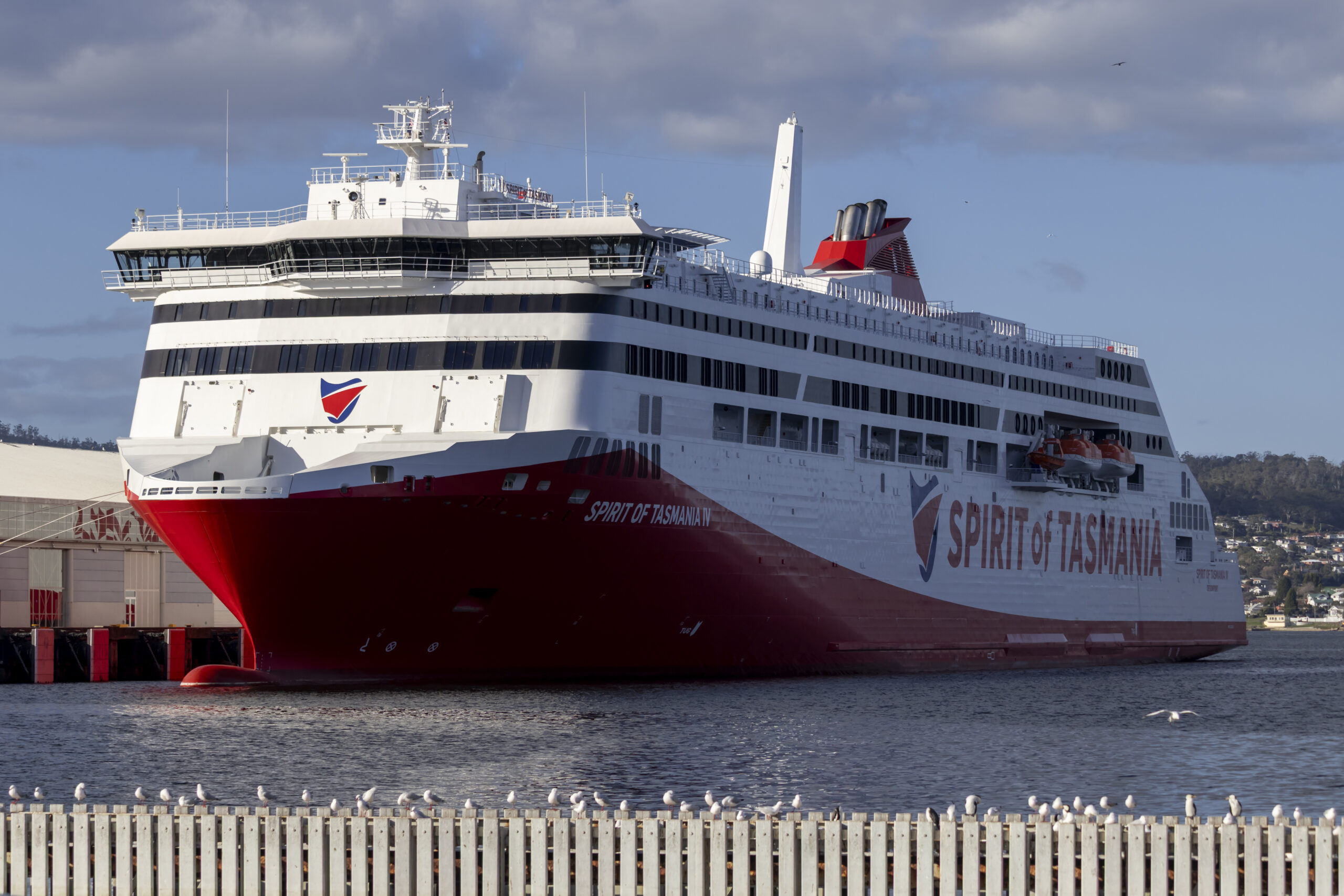 A large boat with red and white colours, It says Spirit of Tasmania on the side