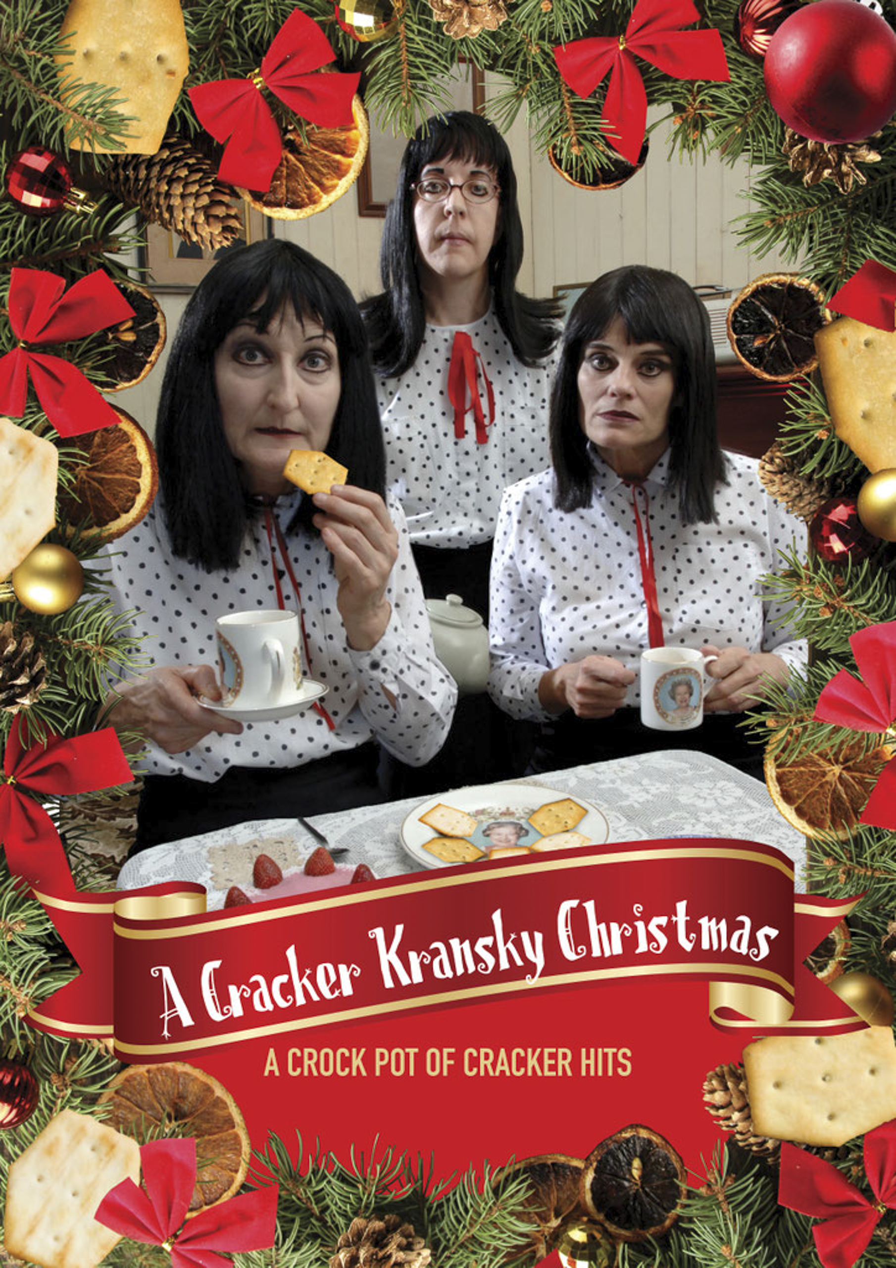 A poster advertising a show called A Cracker Kransky Christmas. Three older women with shoulder-length black hair and matching white spotted tops are drinking cups of tea and eating biscuits