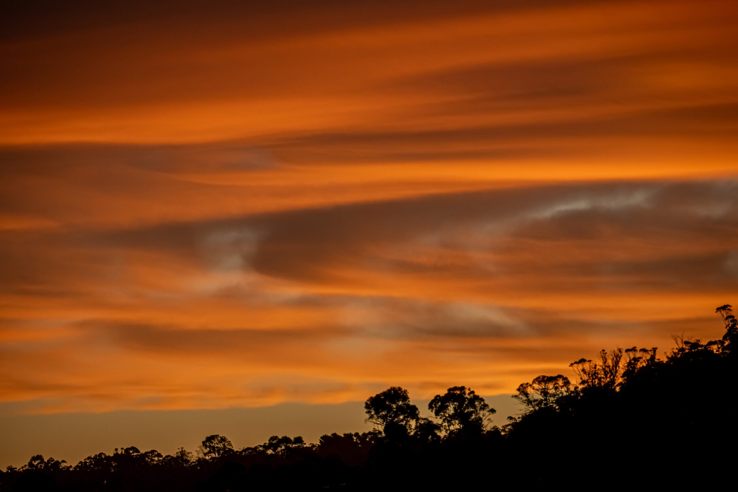 A cloudy orange sunset sky