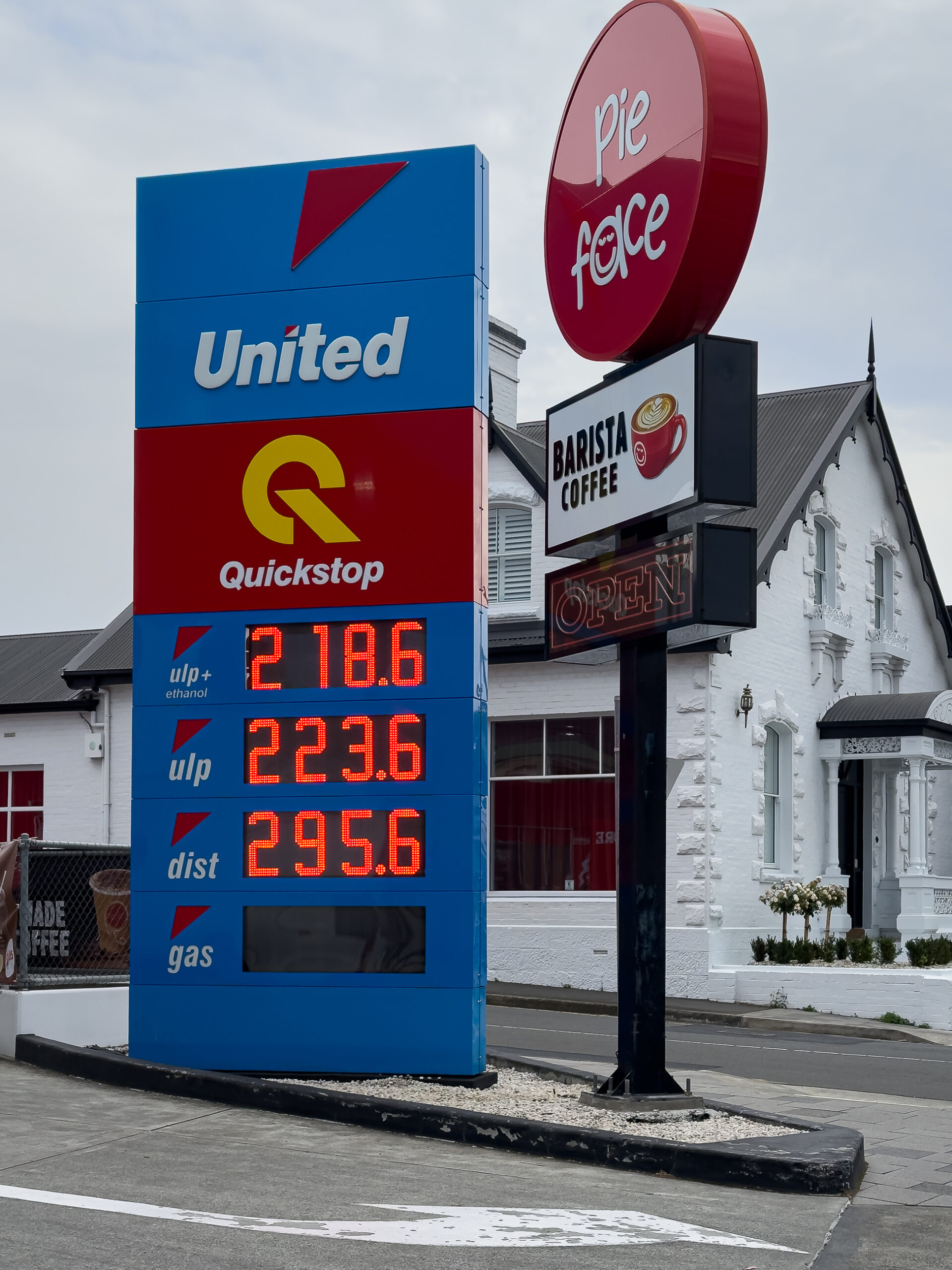 A service station fuel board showing prices between 218.6 and 295.6 for fuel