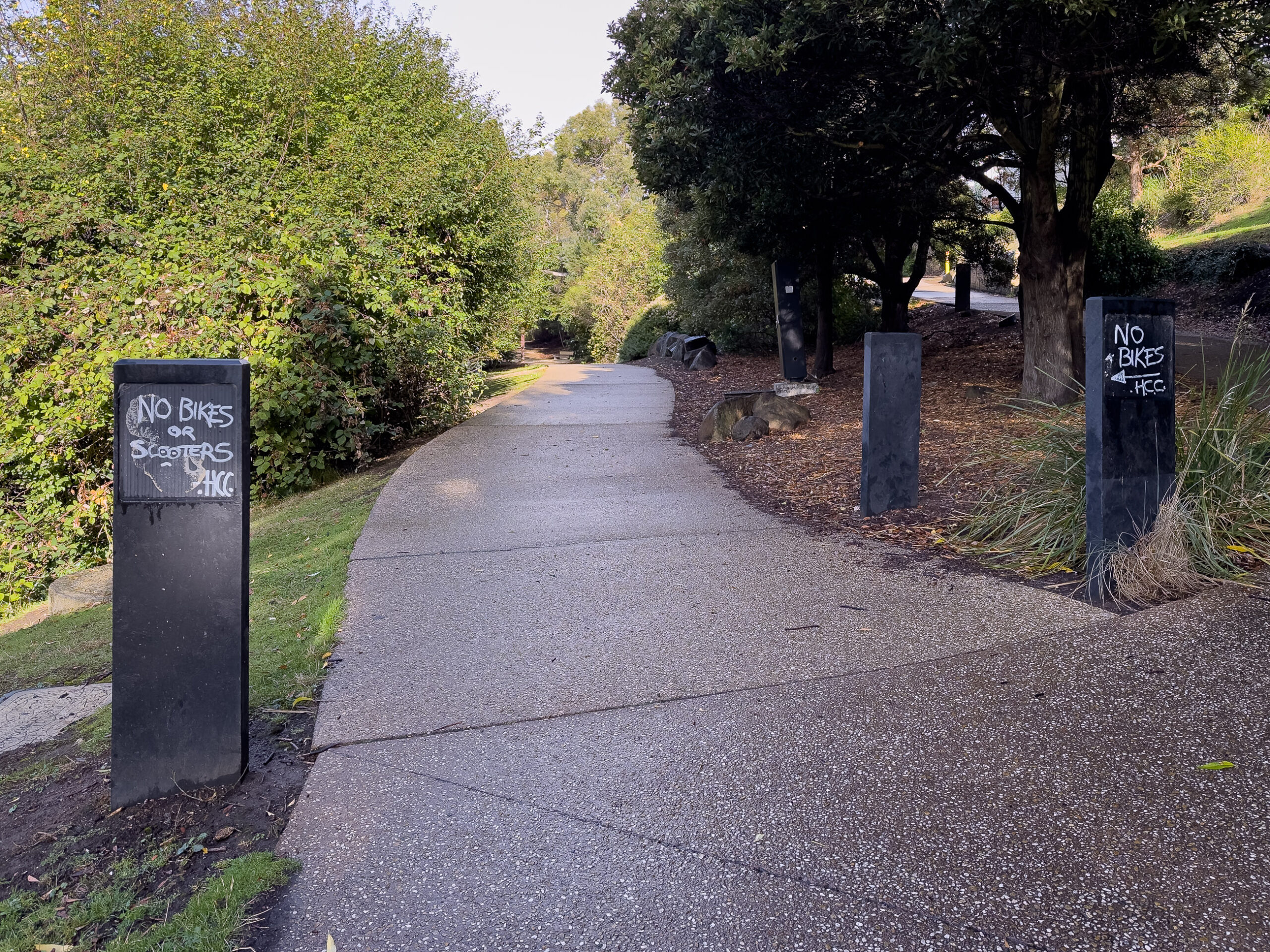 Signs on a track have have been removed so someone has written "no bikes here" on them as this part of the track is not for bikes