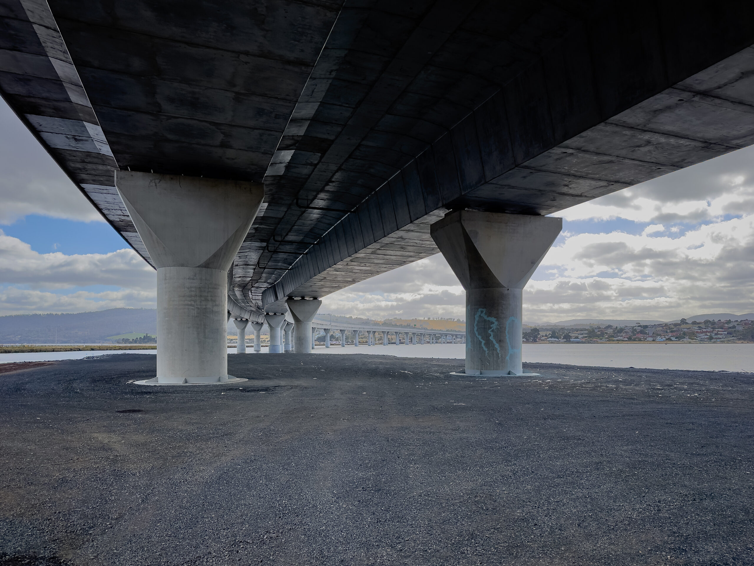View of a large concrete bridge from underneath the bridge