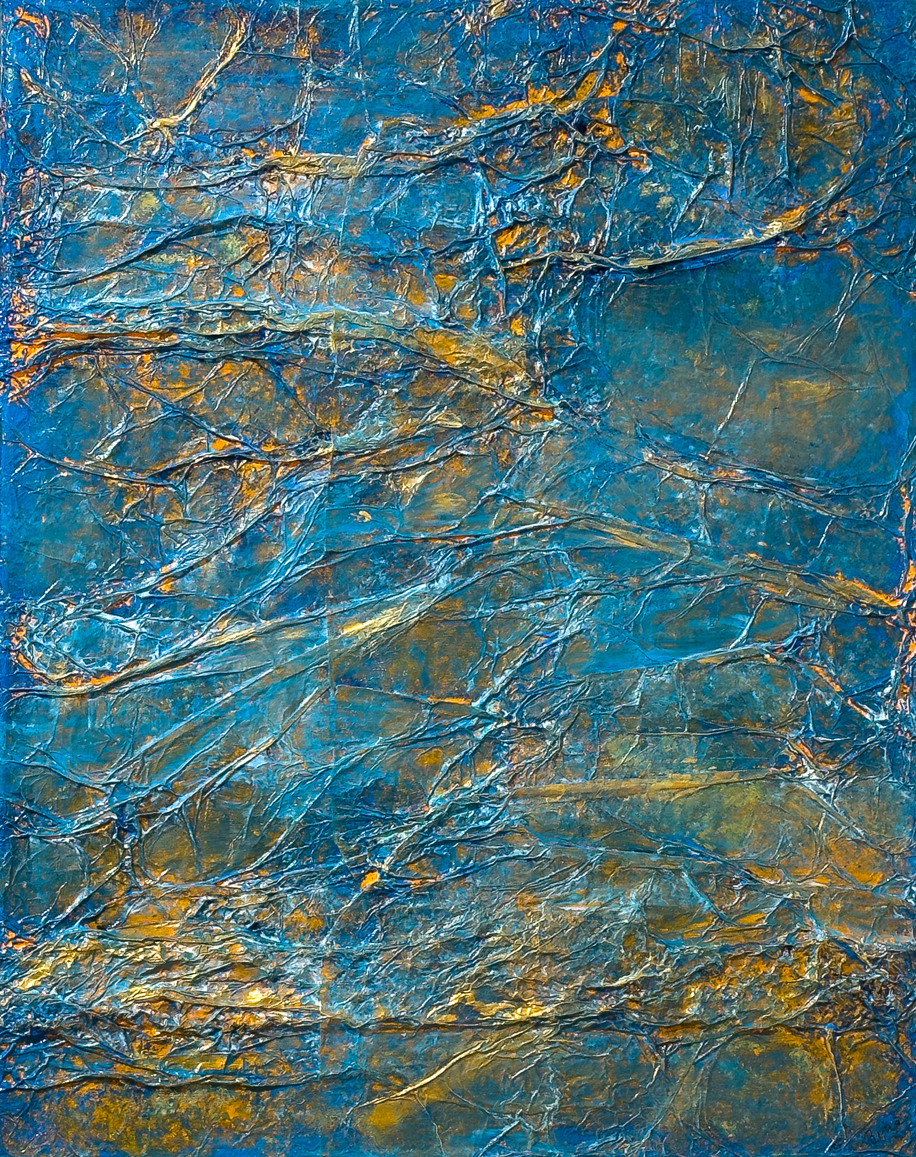 A textured abstract painting of blue and gold