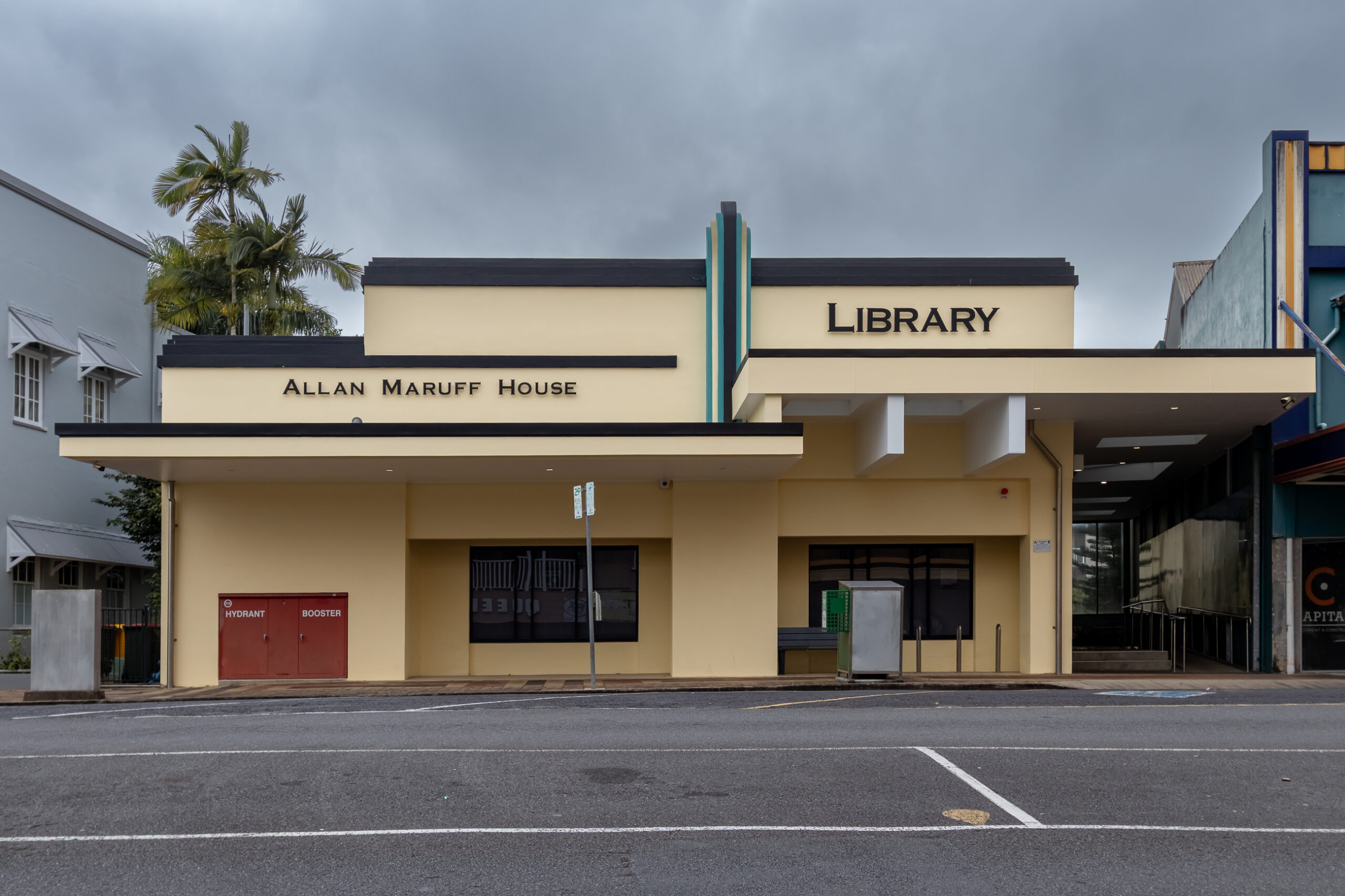 A yellow and brown streamline modern building that is used as a library