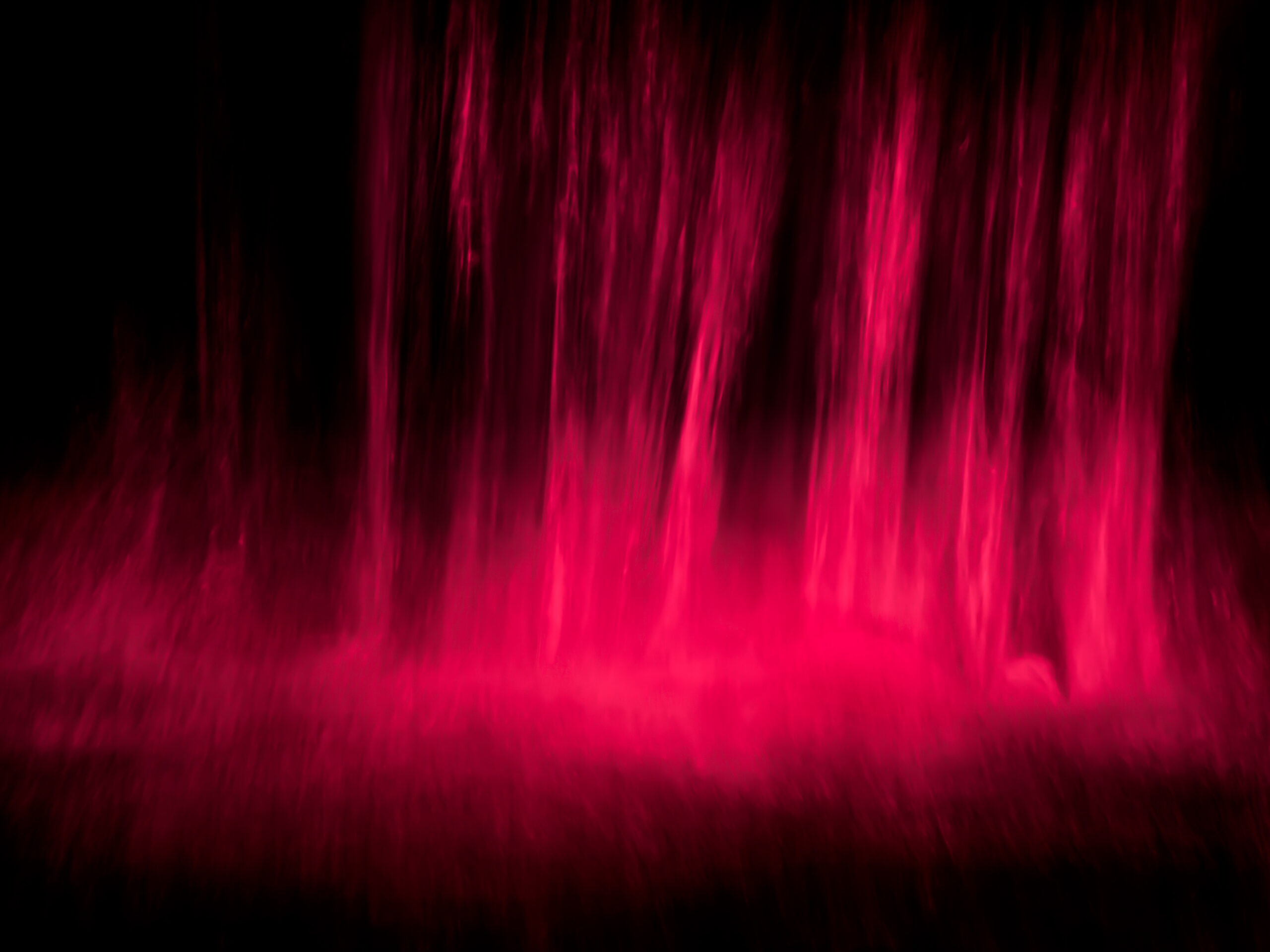 An abstract photo of black and red verticals