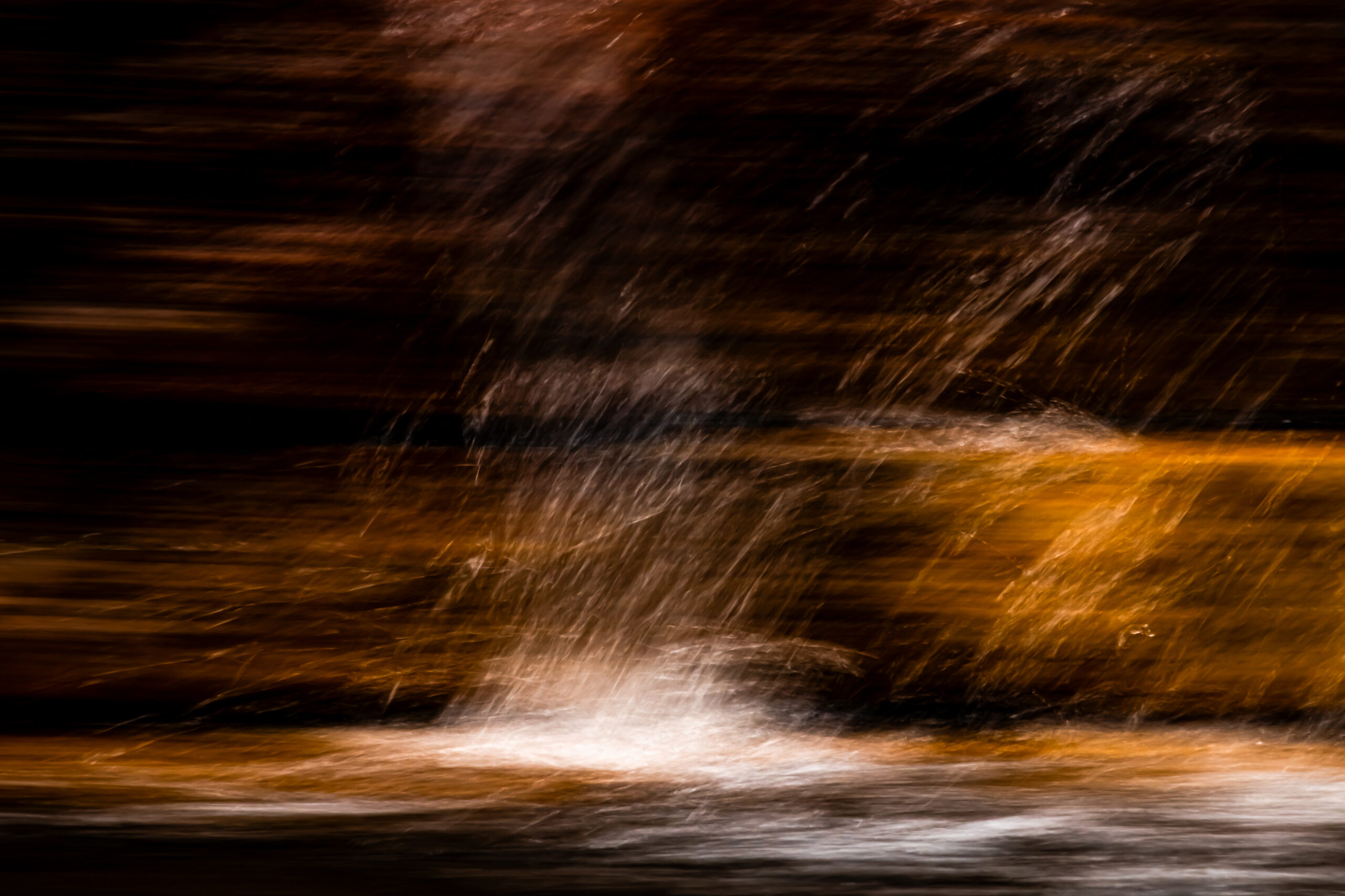 Intentional camera movement with a brown look in splashing water