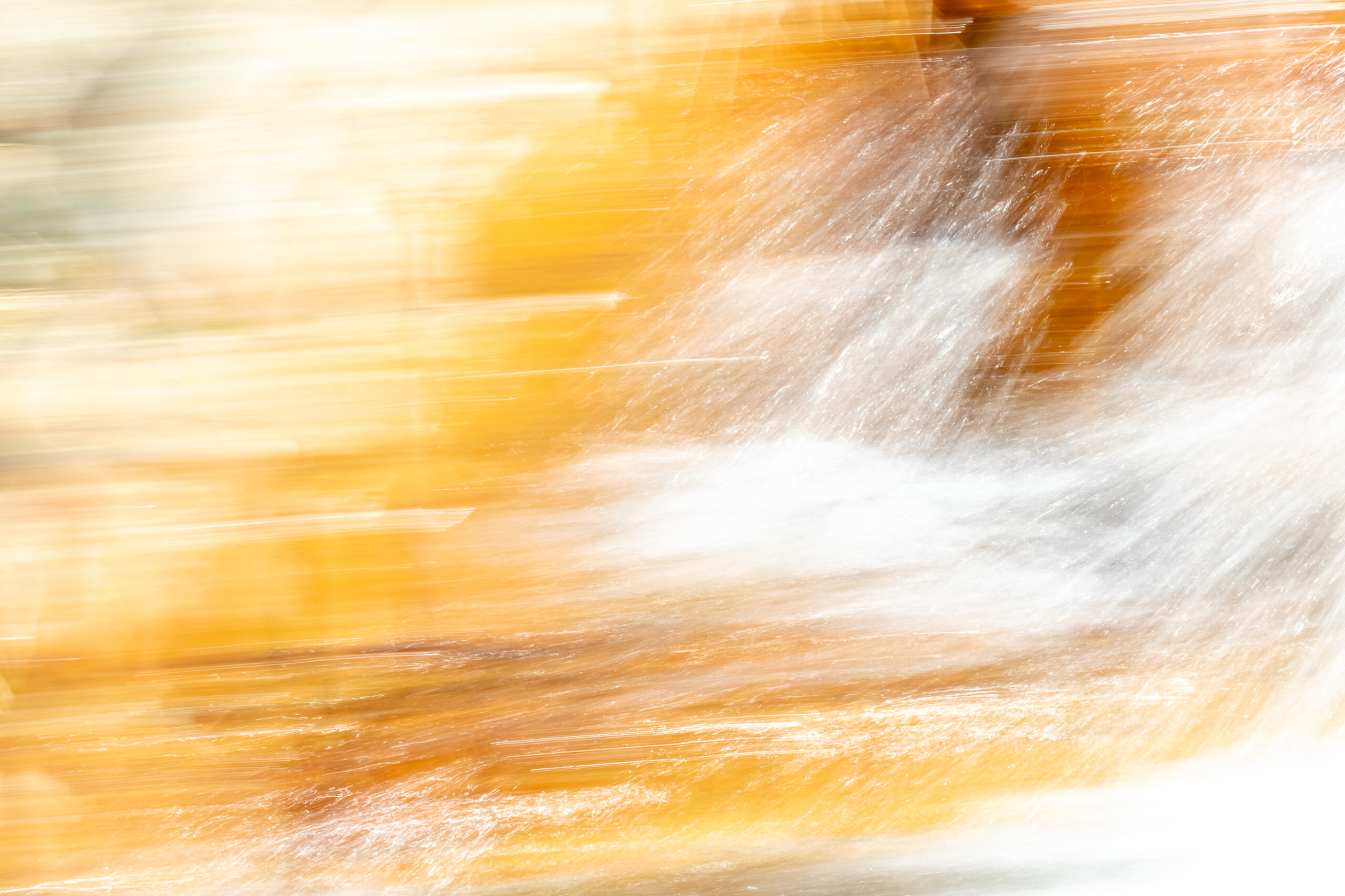 An abstract photo of mainly yellow and white movement